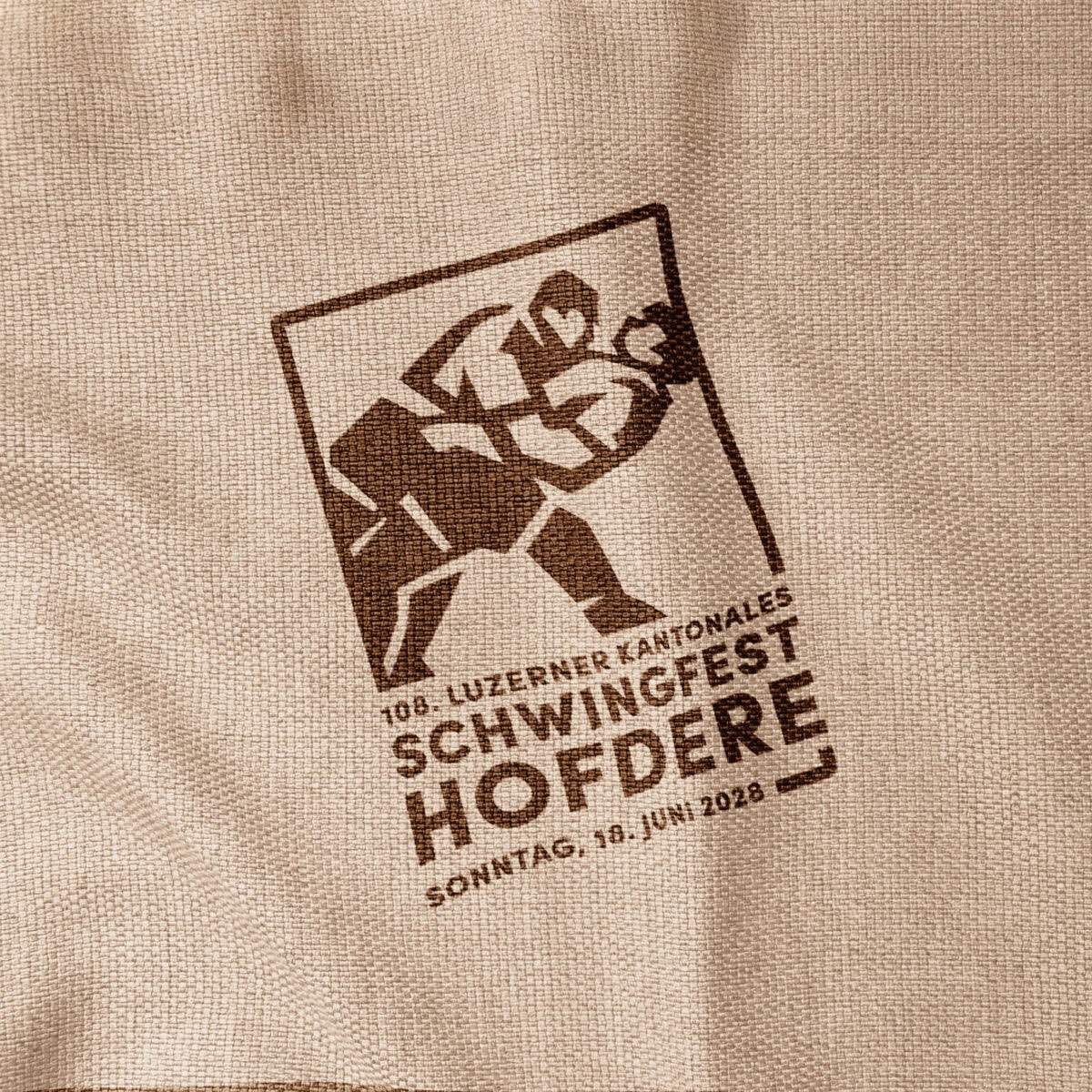 aufdruck des logos «108. luzerner kantonales schwingfest hofdere» auf stoff